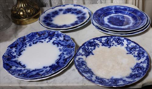 8 odd flow blue plates, 10 in. Dia.: 8 odd flow blue plates, 10 in. Dia.