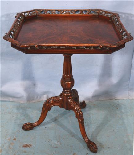 Flame mahogany pie crust tilt top tea table: Flame mahogany pie crust tilt top tea table with claw feet, 30 in. T, 27 in. Sq.