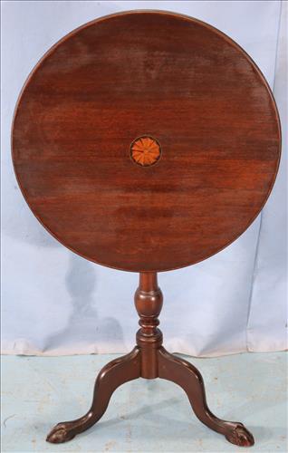 Mahogany tilt top 3 leg table with medallion: Mahogany tilt top 3 leg table with inlaid medallion and claw feet, 27 in. T, 22 in. Dia.