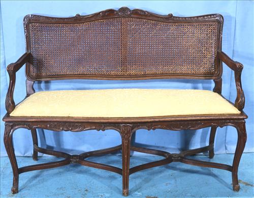 French oak 2 seater bench with cane back: French oak 2 seater bench with cane back extra support, 37 in. T, 49 in. W, 18 in. D.