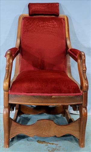 Early walnut recliner chair with head rest: Early walnut recliner chair with head rest and swan head on arms, made by Archer Chair Company, 39 in. T, 23 in. W, 17 in. D.