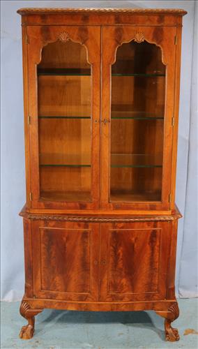 Mahogany Chippendale curio cabinet: Mahogany Chippendale curio cabinet with ball and claw feet and glass shelves, 67 in. T, 33 in. W, 17.5 in. D.