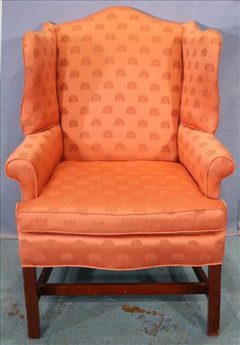 Mahogany Chippendale wing back chair: Mahogany Chippendale wing back chair with good peach colored upholstery, 41 in. T, 29 in. W, 19 in. D.
