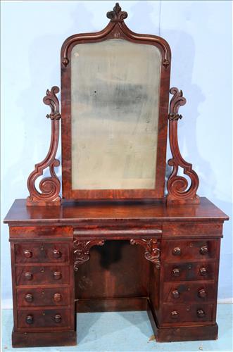 Flame mahogany Empire knee hole dressing table: Flame mahogany Empire knee hole dressing table with drawers on both sides and gothic mirror, 74 in. T, 46 in. W, 18 in. D.