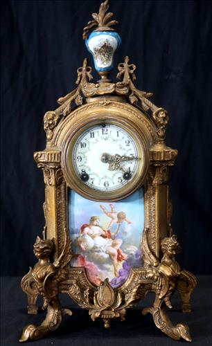 Bronze and porcelain New Haven clock: Bronze and porcelain French style New Haven mantle clock, 17.5 in. T, 8.5 in. W, 3.5 in. D.