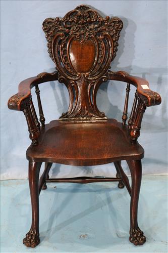 Heavily carved oak Stickley and Brandt arm chair: Heavily carved oak Stickley and Brandt arm chair. 38.5 in. T, 24 in. W, 19 in. D.