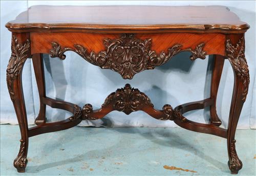 Mahogany heavily carved center table: Mahogany heavily carved center table, 29.5 in. T, 45 in. W, 26.5 in. D.