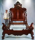 Oversized walnut rococo high back bed