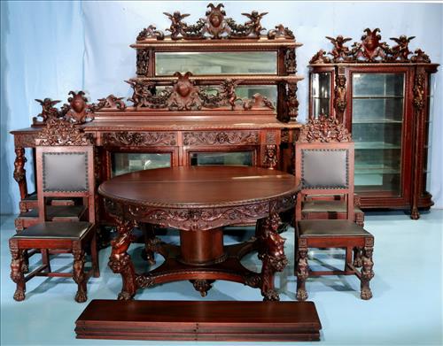 11 piece Mahogany R.J. Horner dining room suit: Beautiful 11 piece Mahogany R.J. Horner dining room suit with cupids, ca. 1890, Table - 30.5 in. T, 55 in. Dia., has five 12 in. leaves, China Cabinet - 80.5 in. T, 56 in W, 19.5 in. D., Sideboard - 9