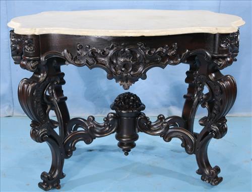 Meeks rosewood carved rococo center table: Meeks rosewood heavily carved rococo center table, 30.5 in. T, 33 in. W, 29 in. D.