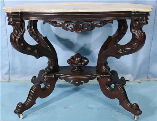 Walnut Victorian turtle top table with marble: Walnut Victorian turtle top table with white marble, flower basket finial, 42 in. W, 30 in. T, 26.5 in. D.
