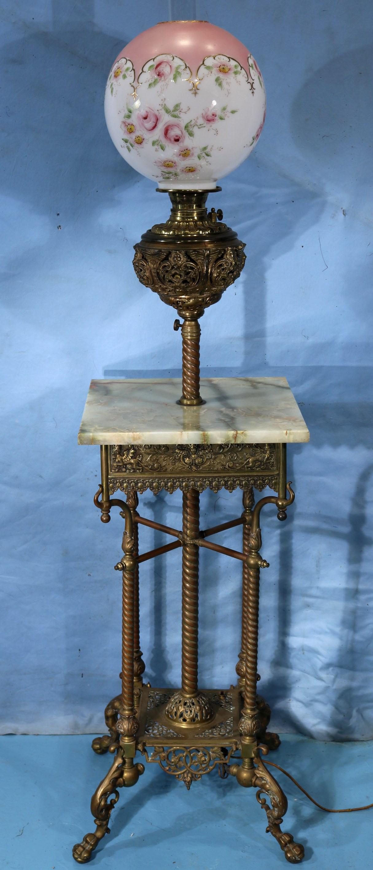 Victorian brass and onyx piano lamp on base: Victorian brass and onyx piano lamp with detail work on base and ball and claw feet, early conversion to electric, ca. 1880, 62 in. T.