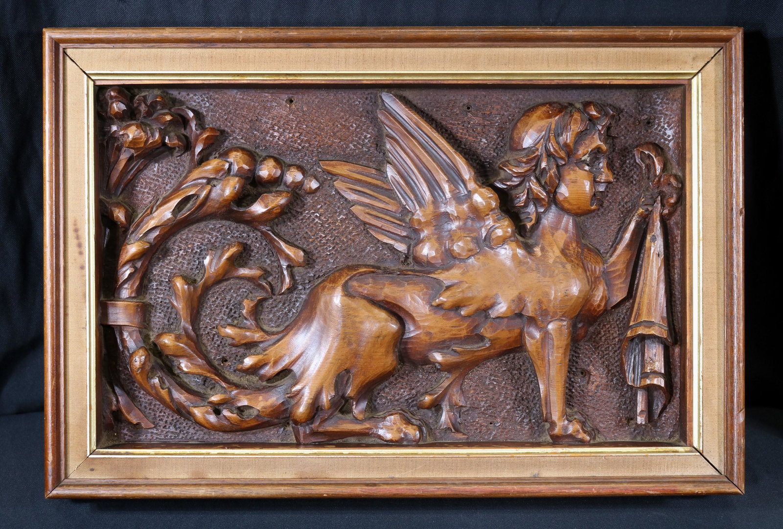 Carved wood panel of mythological figure: Carved wood panel of mythological figure in walnut shadow box frame, 21 x 14