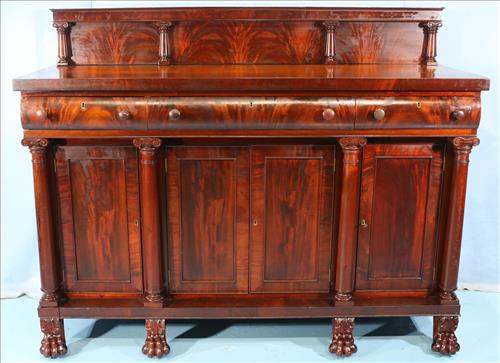 Mahogany Empire sideboard with linen drawers: Mahogany Empire sideboard with center linen drawers and claw feet, in good condition, 66 in W, 53 in. T, 24 in. D.