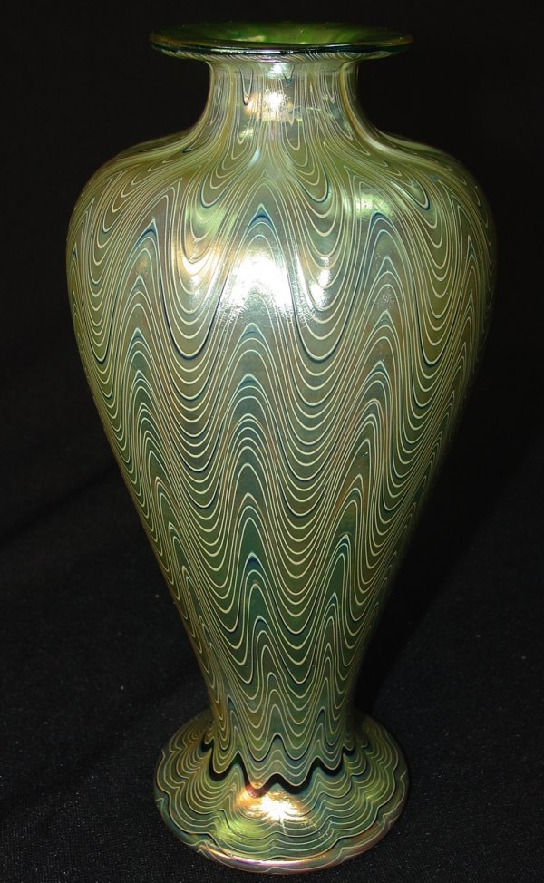 Loetz "Phänomen Genres #6893" Art Glass Vase: Loetz "Phanomen Genres" #6893, Iridescent Art Glass Vase with Upward Threaded Design and forged L.C.T. signature. 9.25 in. T. X 4 in. Dia. "Phänomen"