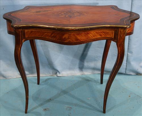 Rosewood French inlaid center table: Rosewood French inlaid center table with marquetry top and drawer, 29 in. T, 39 in. W, 24 in. D.