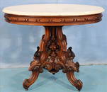 Walnut Victorian oval center table by T. Brooks