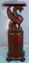 Mahogany round pedestal with wing griffin top