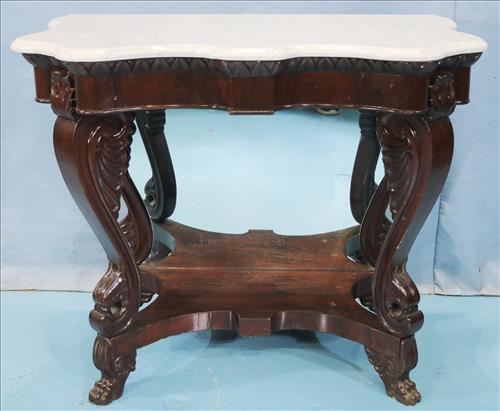 Mahogany small pier table with wing supports: Mahogany small pier table with wing supports, mirrored back and white marble top, 28 in. T, 32 in. W, 20 in. D.