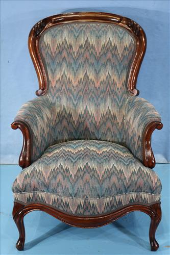 Walnut Victorian gentleman's parlor chair: Walnut Victorian gentleman's parlor chair with like new flamed stitched upholstery, 39 in. T, 26 in. W, 21 in. D.