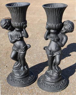 Pair of cast iron figural planters, 38 in. T, 15 in. W.: Pair of cast iron figural planters, 38 in. T, 15 in. W.