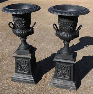 Pair of 2 piece cast iron garden urns with handles: Pair of black 2 piece cast iron garden urns with handles, 41 in. T,19 in. W.