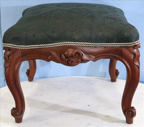 Period walnut Victoran foot stool: Period walnut Victoran foot stool with carved front and legs, 15 in. T, 21 in. W, 22 in. D.