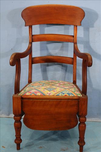 Cherry potty chair in great condition, 43 in. T, 22 in.: Cherry potty chair in great condition, 43 in. T, 22 in. W, 17 in. D.
