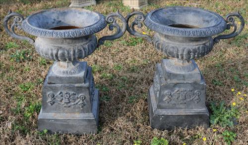 Pair of cast iron garden urns with handles, 27 in. T.: Pair of cast iron garden urns with handles, 27 in. T, 28 in. W.