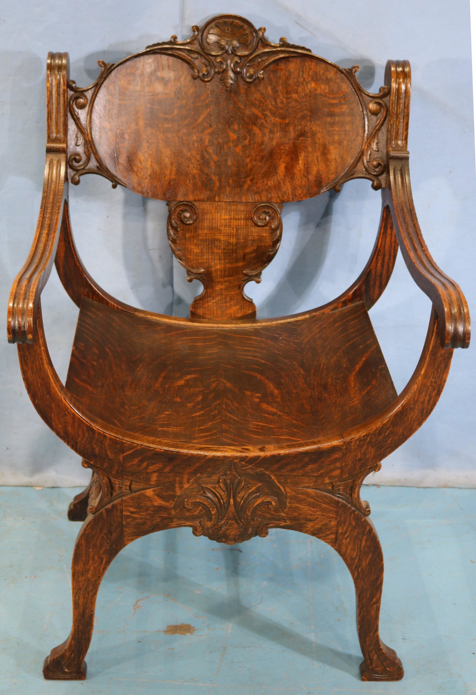 Quarter sawn oak saddle chair: Quarter sawn oak saddle chair, 36 in. T, 23 in. W, 19 in. D