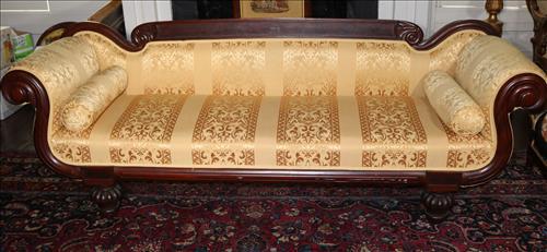Mahogany Empire carved parlor sofa, yellow upholstery: Mahogany Empire parlor sofa with rounded carving on corners and yellow upholstery, 31 in. T, 24 in. D, 89 in. L.