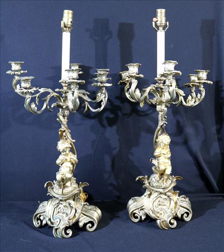 Pair of bronze cupid lamps with candelabra on top (1 of 5)