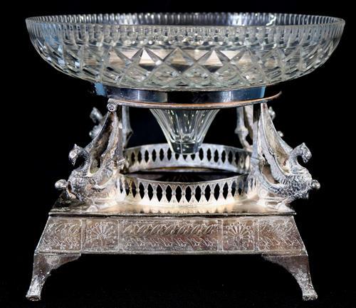 Silver-plate centerpiece with winged griffins: Silver-plate centerpiece with winged griffins and cut glass bowl, 9 in. T, 11 in . Dia.