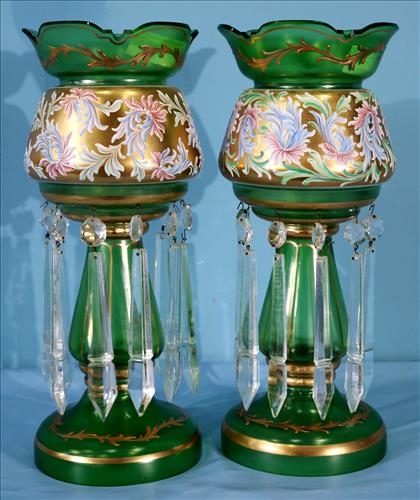 Pair of green lusters with enamel design and gold paint: Pair of green lusters with enamel design and gold paint, has 3 prisms missing, 16 in. T.