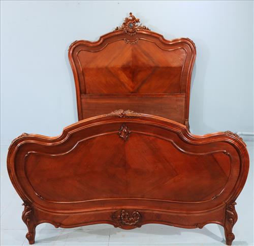 Walnut French bed with carved headboard: Walnut French bed with carved headboard and original finish, good condition, 64 in. T, 51 in. W.