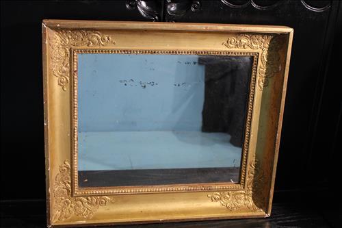 Gold framed mirror with applied carving, 21 x 24: Gold framed mirror with applied carving, 21 in. T, 24 in. W.