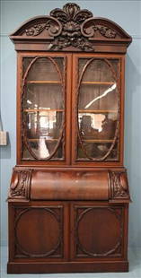 Tall walnut Victorian secretary desk with oval doors: Tall walnut Victorian secretary desk with heavily carved oval doors and thick slant front writing surface - unusual, 9 ft. 10 in. T, 47.5 in. W. 23 in. D.