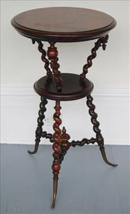 Mahogany round 2 tier barley twist plant stand: Mahogany round 2 tier barley twist plant stand with brass horn style feet, attrib. to Stickley, 30 in. T, 17 in. R.