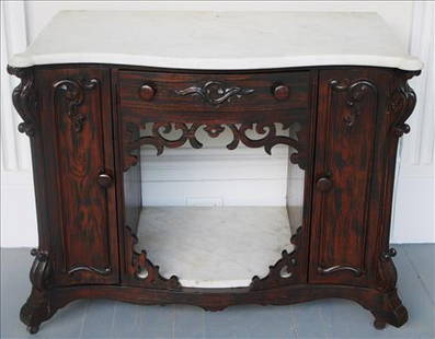 Rosewood Meeks washstand with marble insert: Rosewood Meeks washstand with to and bottom marble insert, 31 in. T, 37 in. W, 19 in. D.