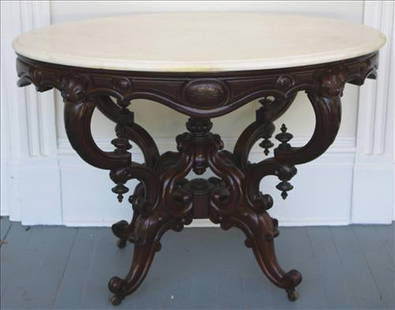 Rosewood rococo Victorian center table with original marble: Rosewood rococo Victorian center table with original marble, 40 in. W, 30 in T, 31 in. D.