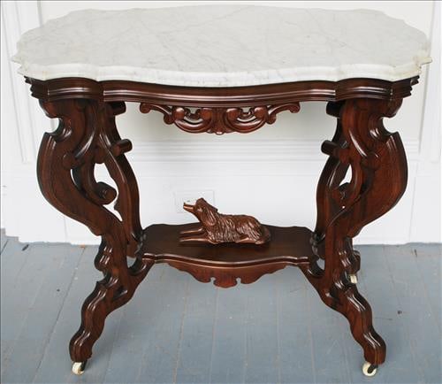 Rosewood grain Victorian parlor table with carved dog (1 of 3)