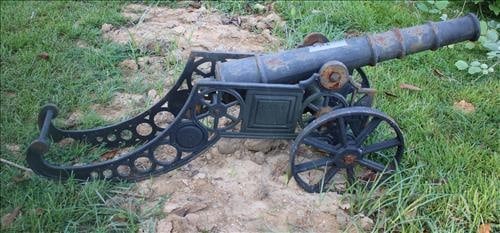 Black cast iron lawn cannons, 24 in. T, 60 in. L, 11 in. D. (1 of 2)