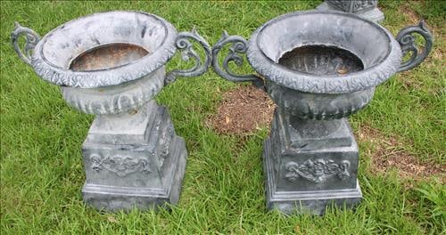 Pair of cast iron double handle gray urns on base (1 of 2)