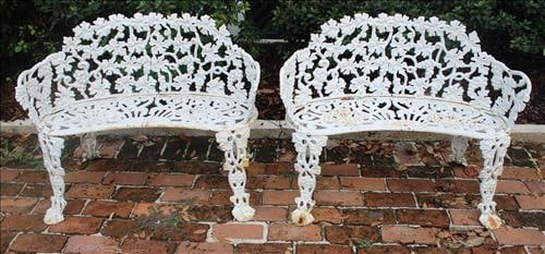Pair of heavy cast iron love seats with grapes and leaves: Pair of heavy cast iron love seats with grapes and leaves, 28.5 in. T, 37.5 in. W, 13 in. D.