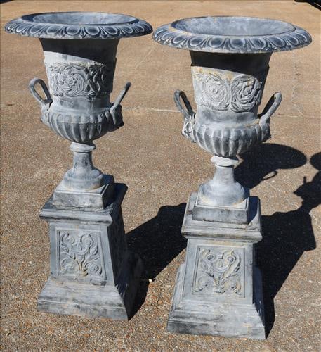 Pair of large cast iron double handle urns on stand (1 of 1)