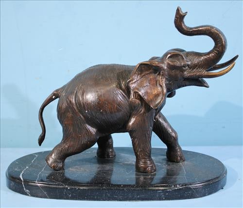 Bronze of an elephant on grey marble base, 13 in. T, 16 in. W. (1 of 4)