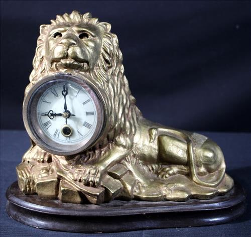 Metal and gold gilt mantle clock in form of lion on stand (1 of 5)