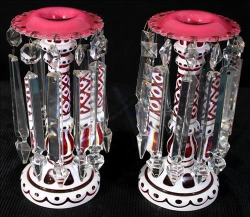 Pair of small white cut to cranberry mantle lusters: Pair of small white cut to cranberry unusual mantle lusters with mismatched prisms, 9 in. T, 4 in Dia.