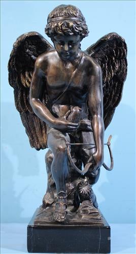 Bronze of cupid figure on black marble base, 16 in. T, 8 in. W. (1 of 4)