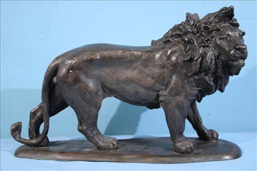 Bronze of a lion, 13 in. T, 19 in. W, 6 in. D.: Bronze of a lion, 13 in. T, 19 in. W, 6 in. D.